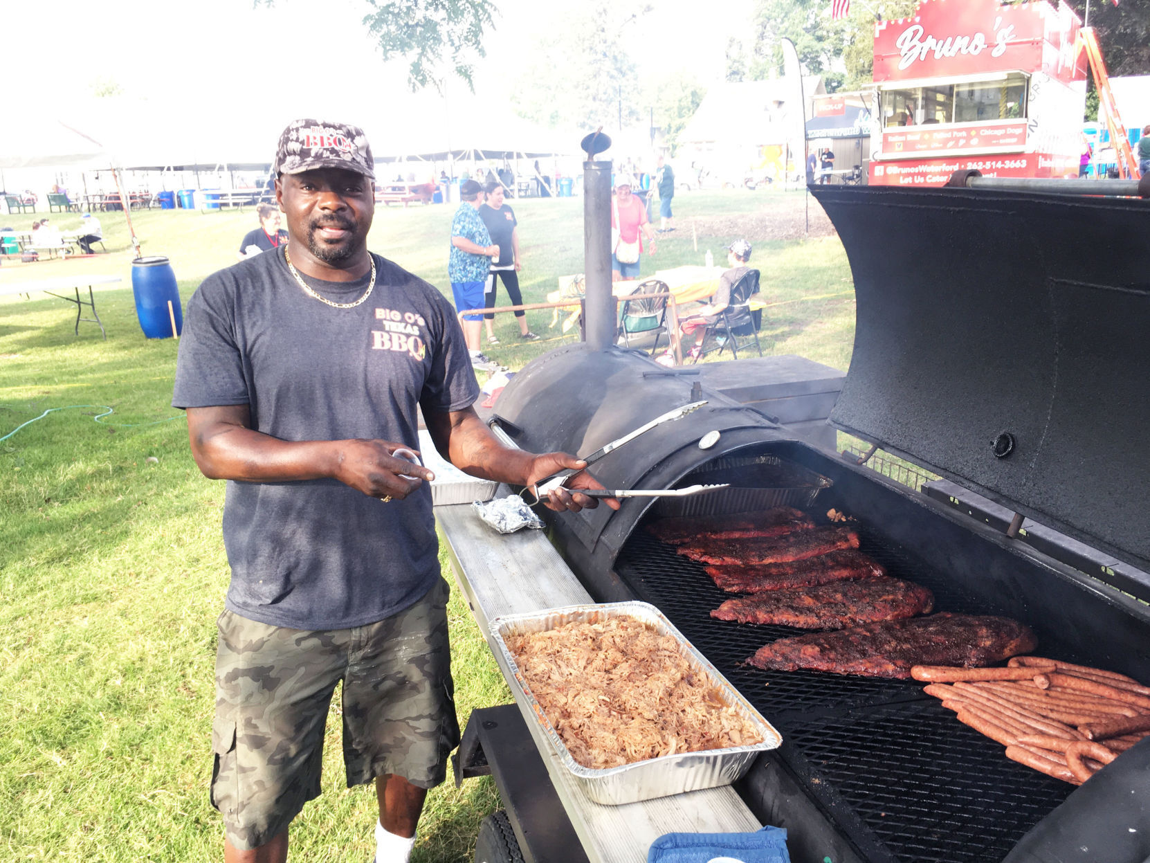 Otis Moss works his barbecue smoker at Lions Fun Fest in Waterford